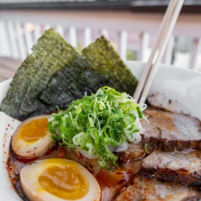 A bowl of ramen with meat and eggs